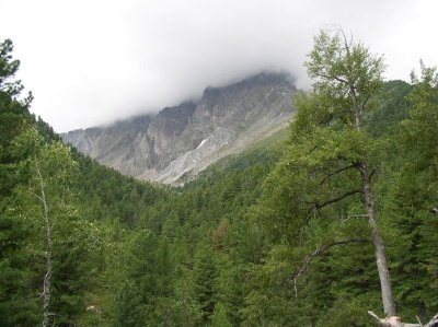 Trail walks deep between high mountains