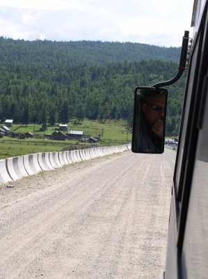 Driver rides unpaved road